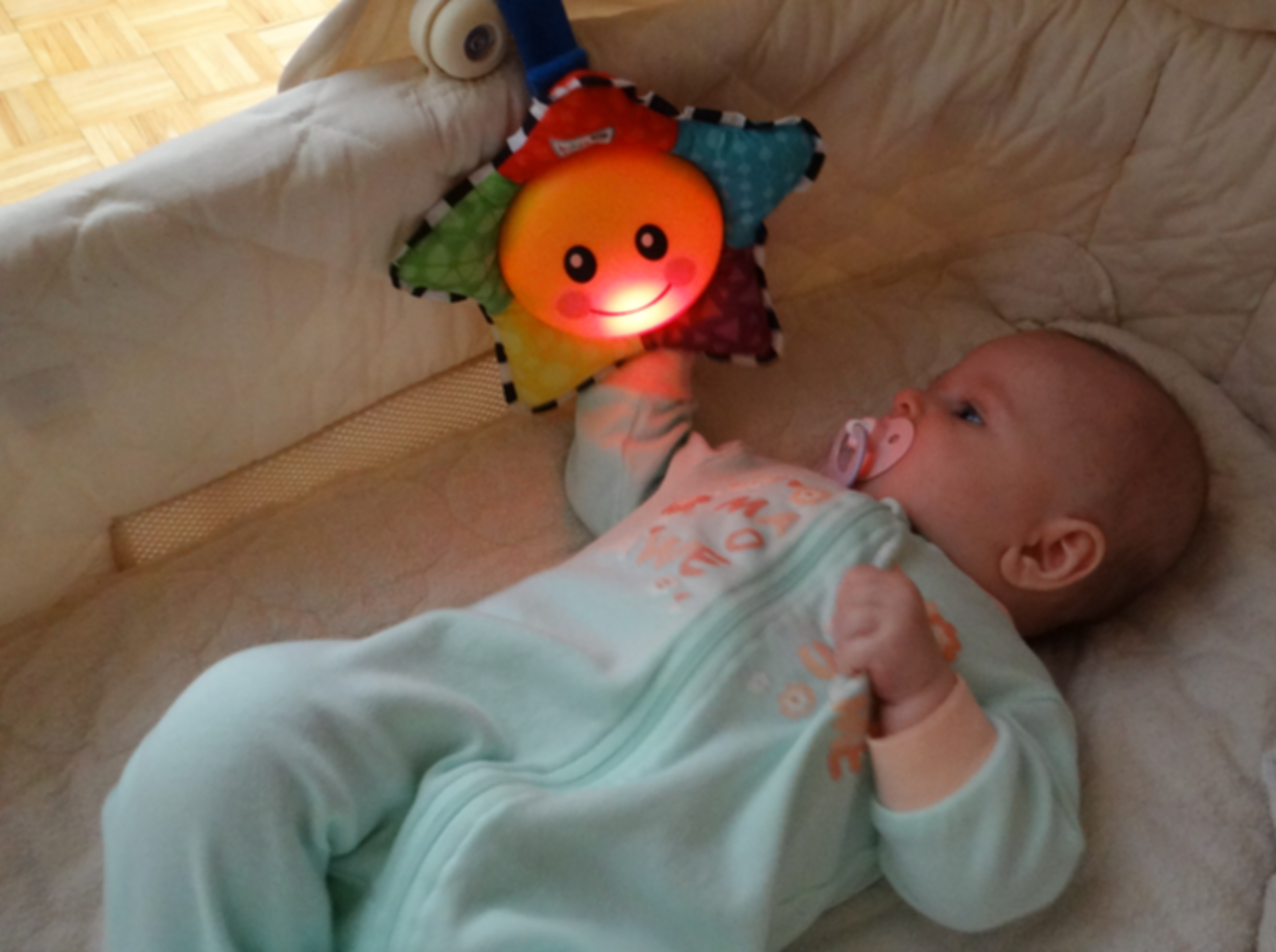 Baby playing with Baby Einstein Star Bright Symphony