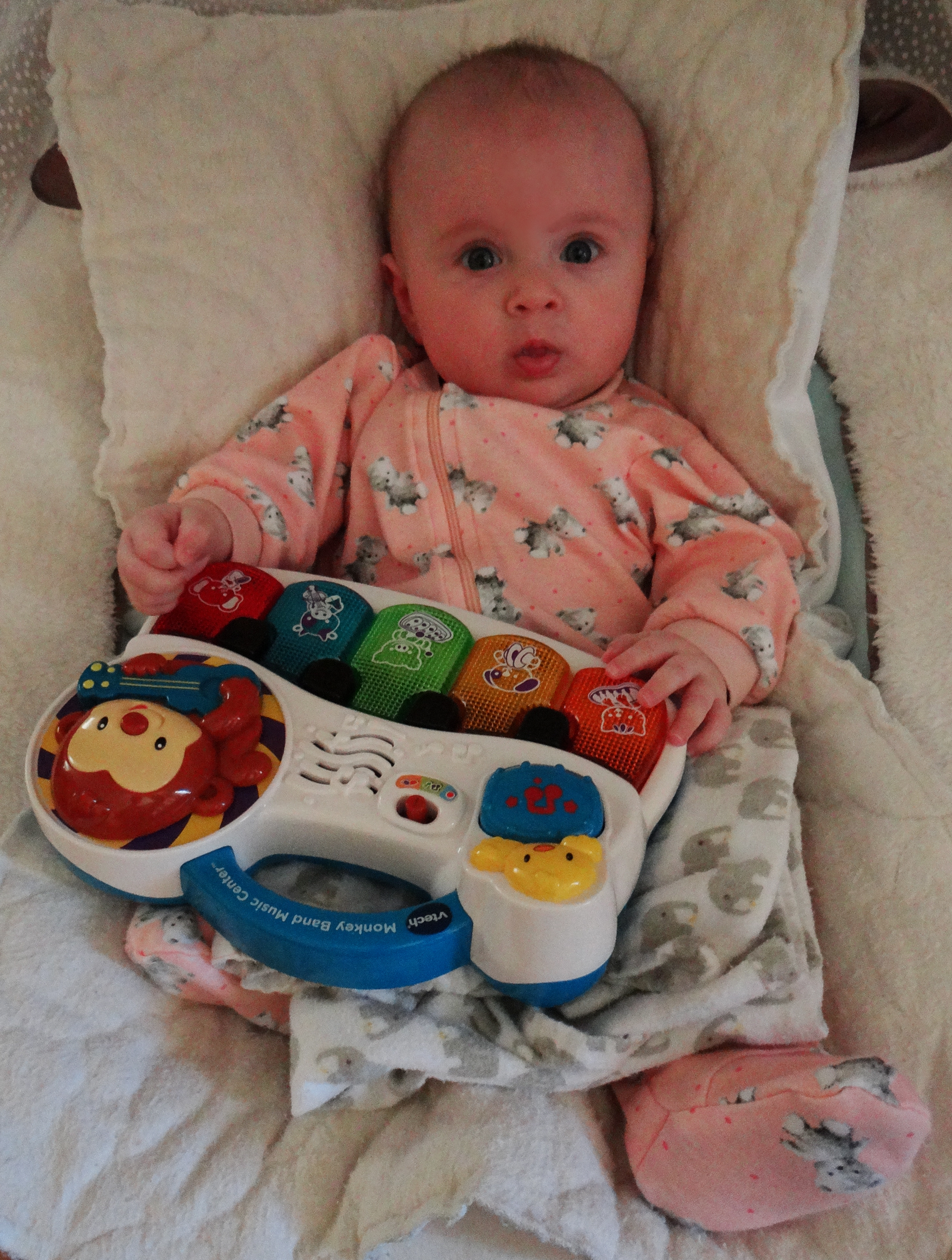 Baby with the Vtech Monkey Band Music Center