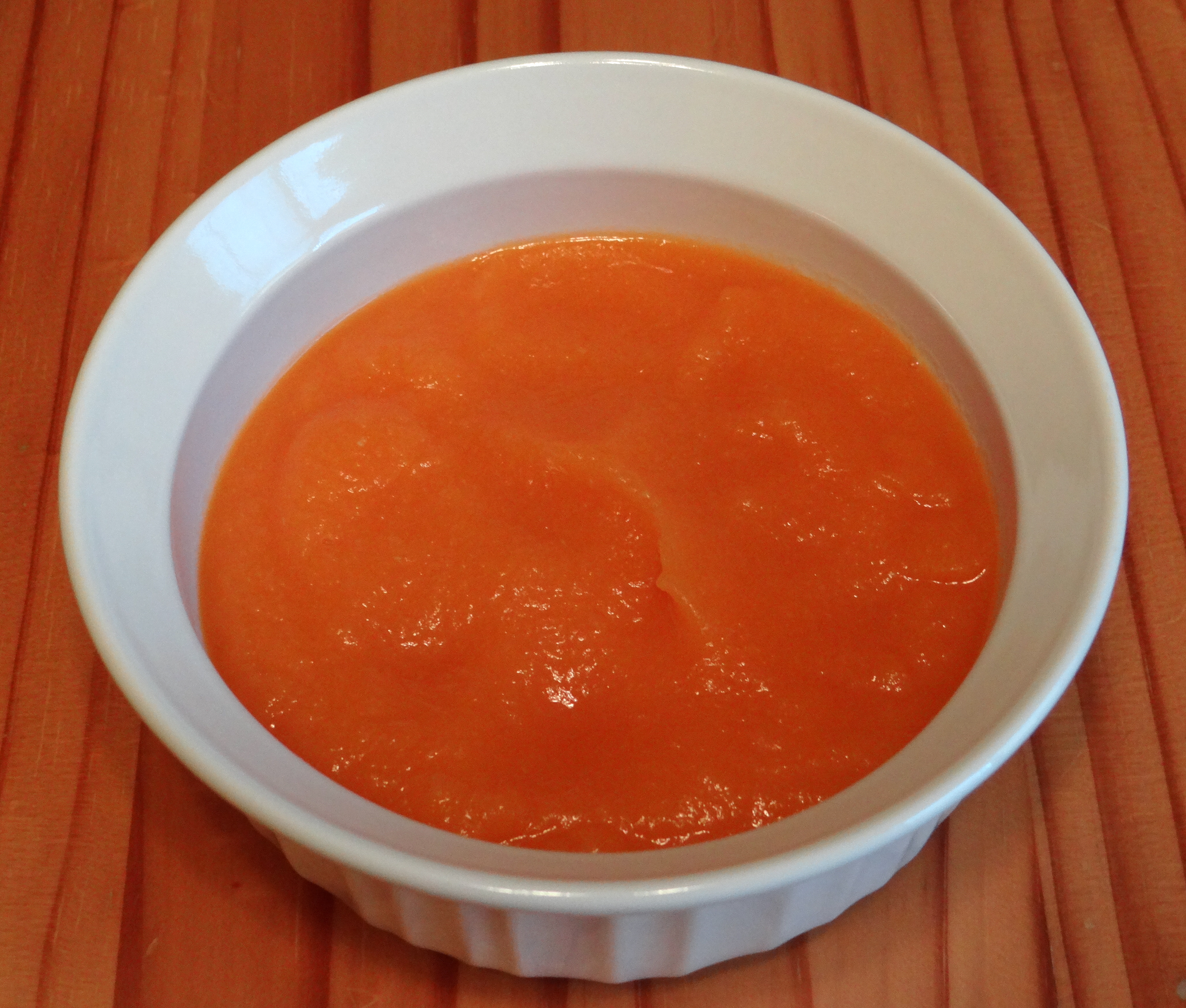 Baby food made with organic spaghetti squash, pear, and carrot puree.
