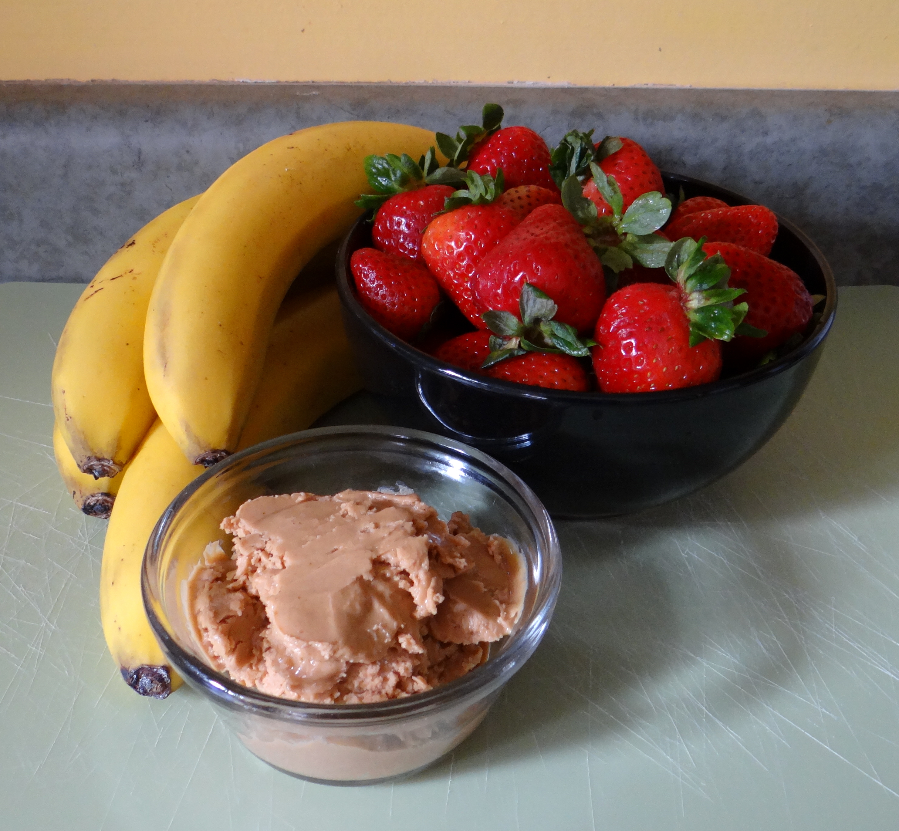 Organic bananas, strawberries, and peanut butter