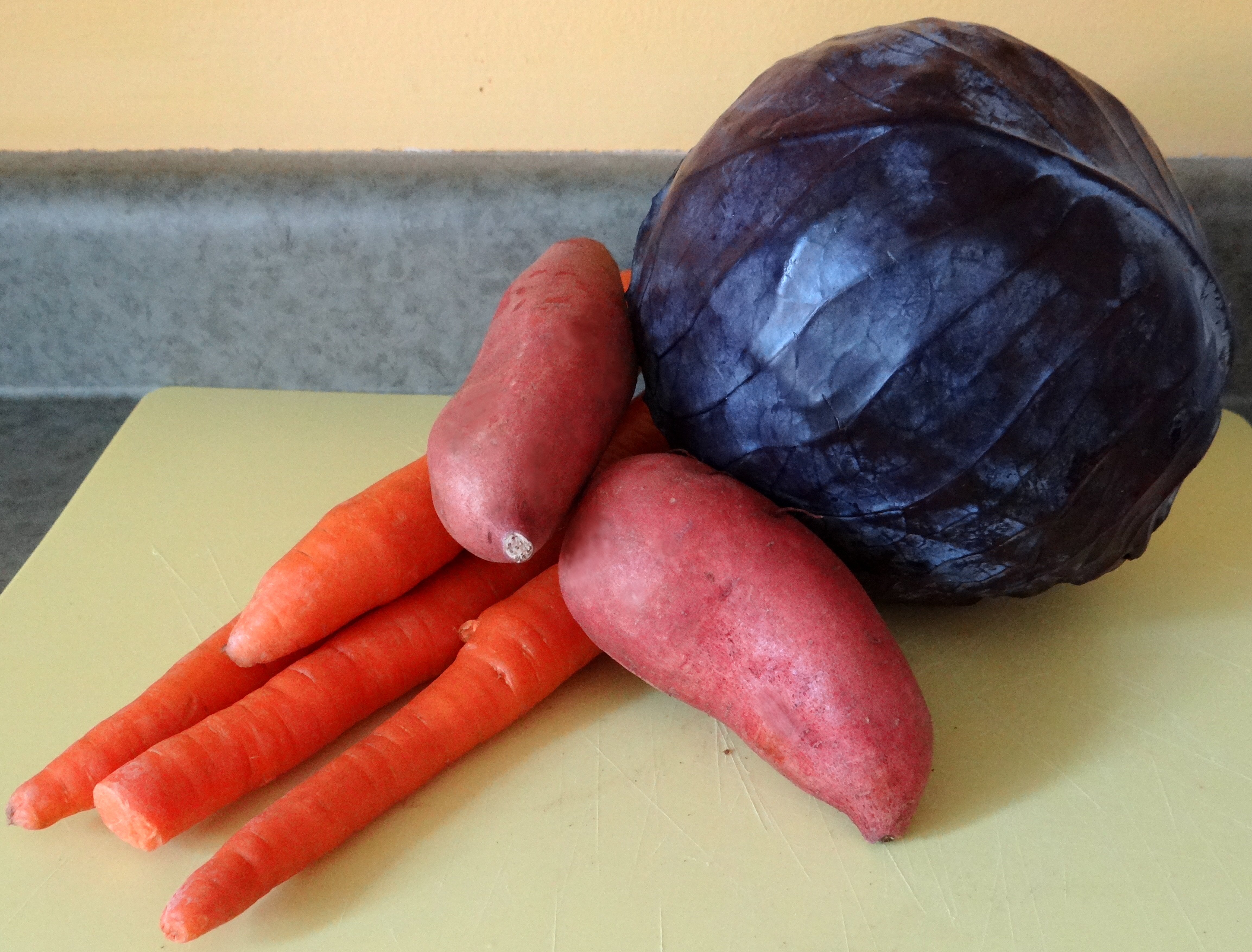Organic purple cabbage, sweet potato, and carrot