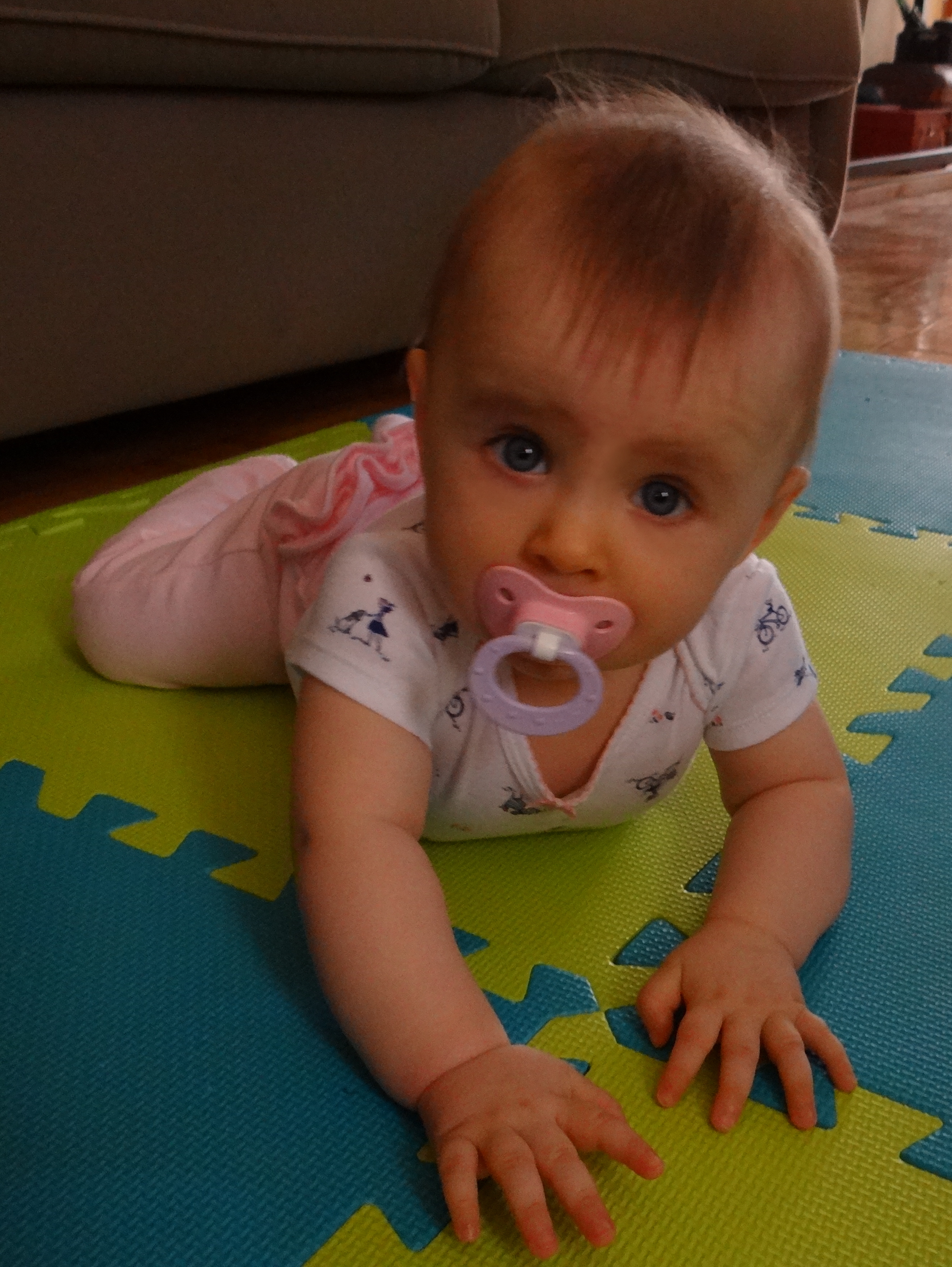 Baby learning to crawl on tummy
