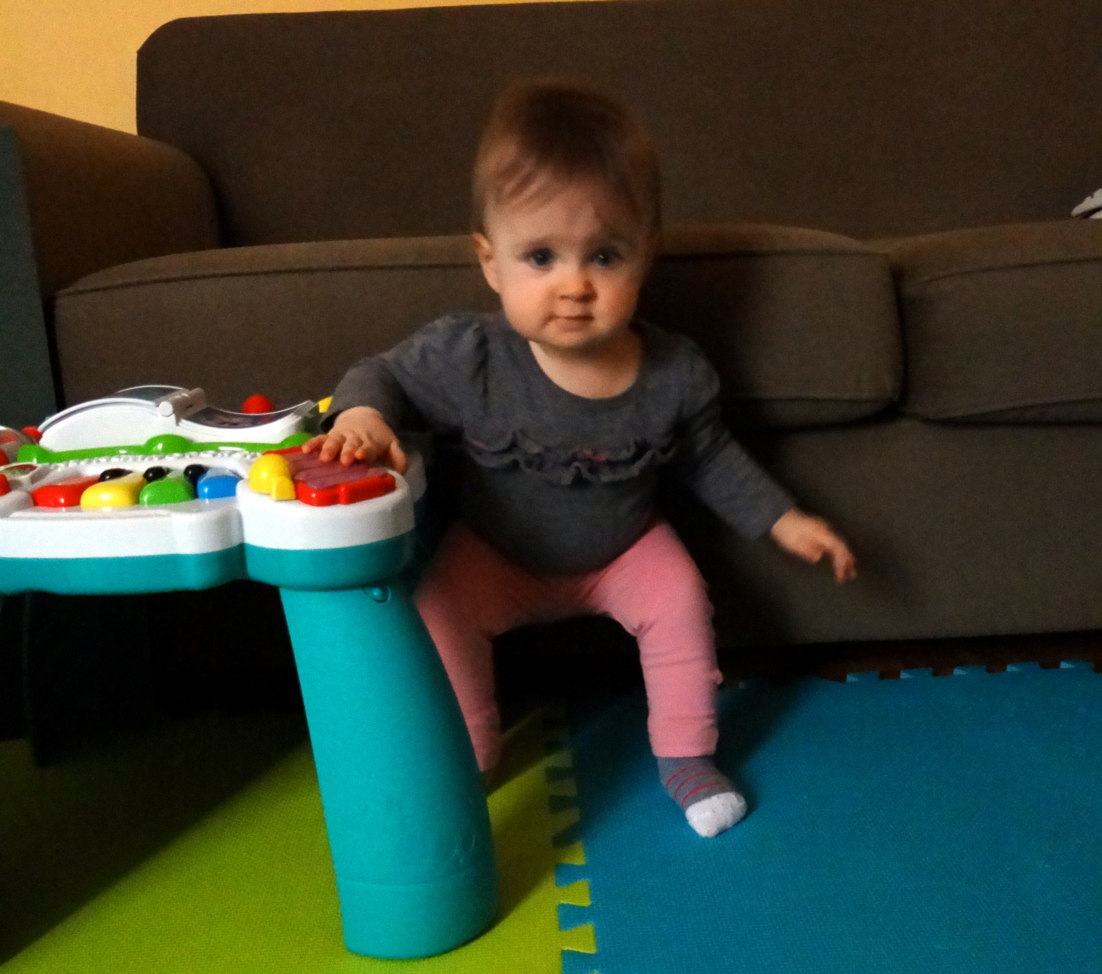 Baby trying to sit back down from standing position
