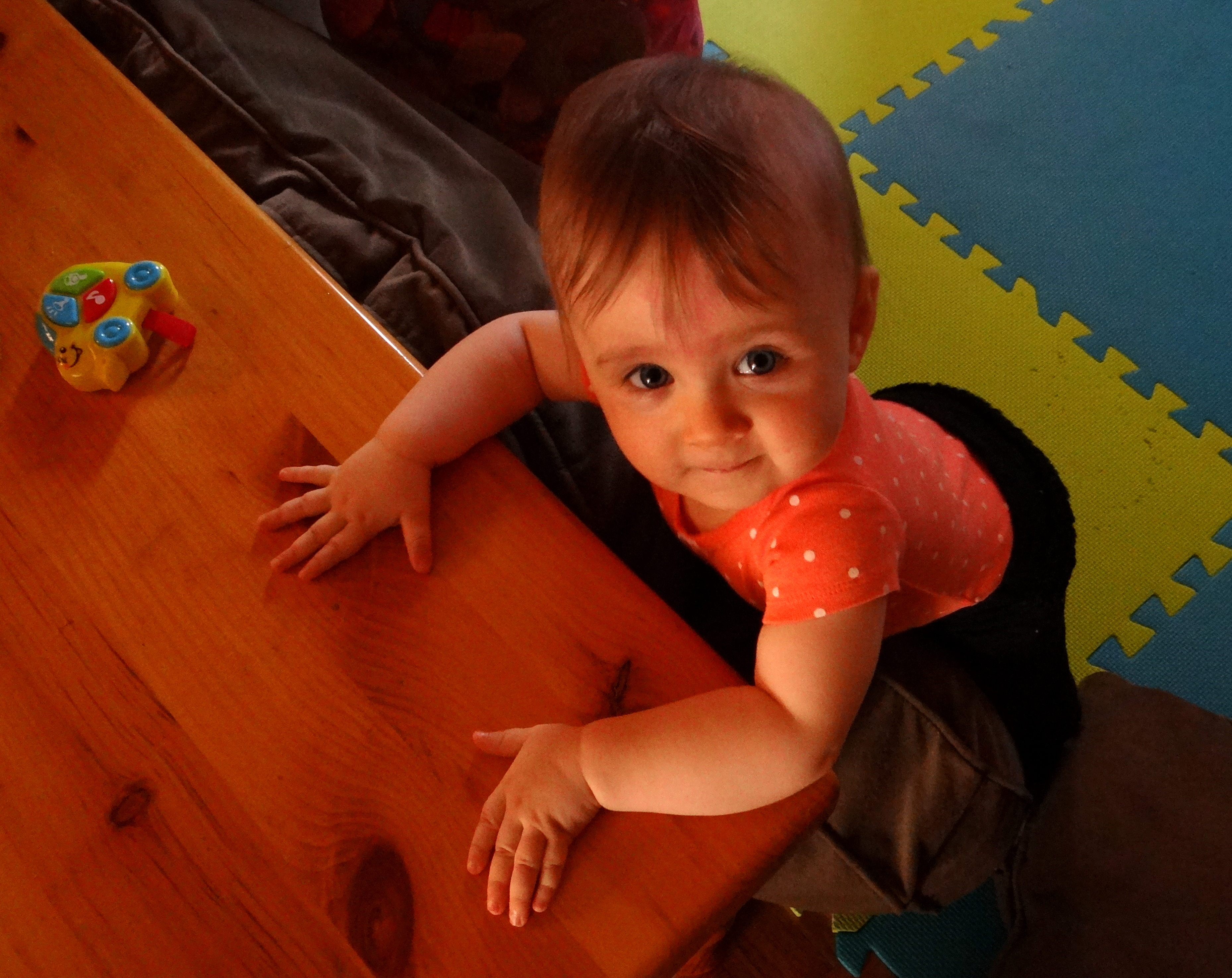 Baby standing while holding the coffee table