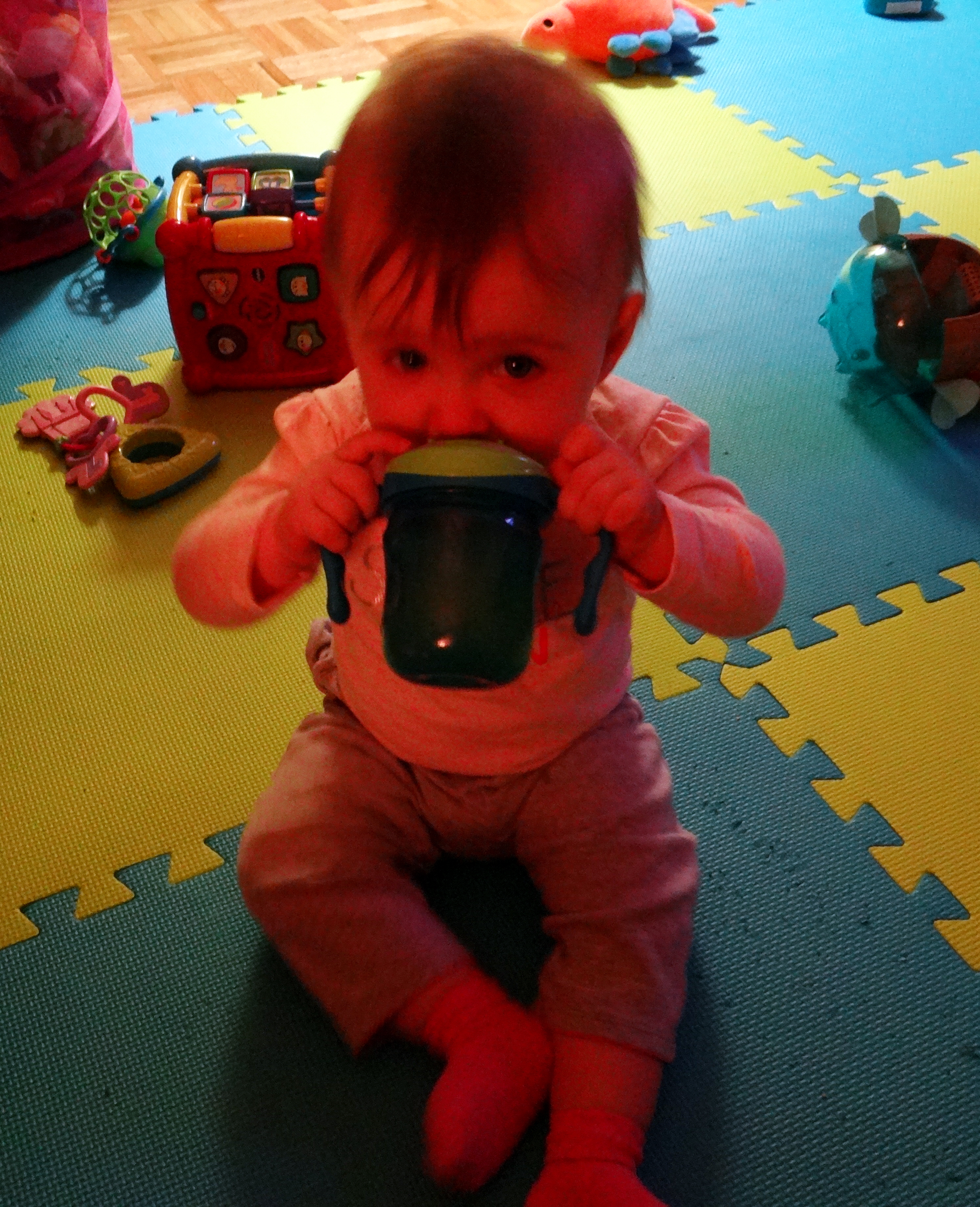 Baby drinking from a sippy cup