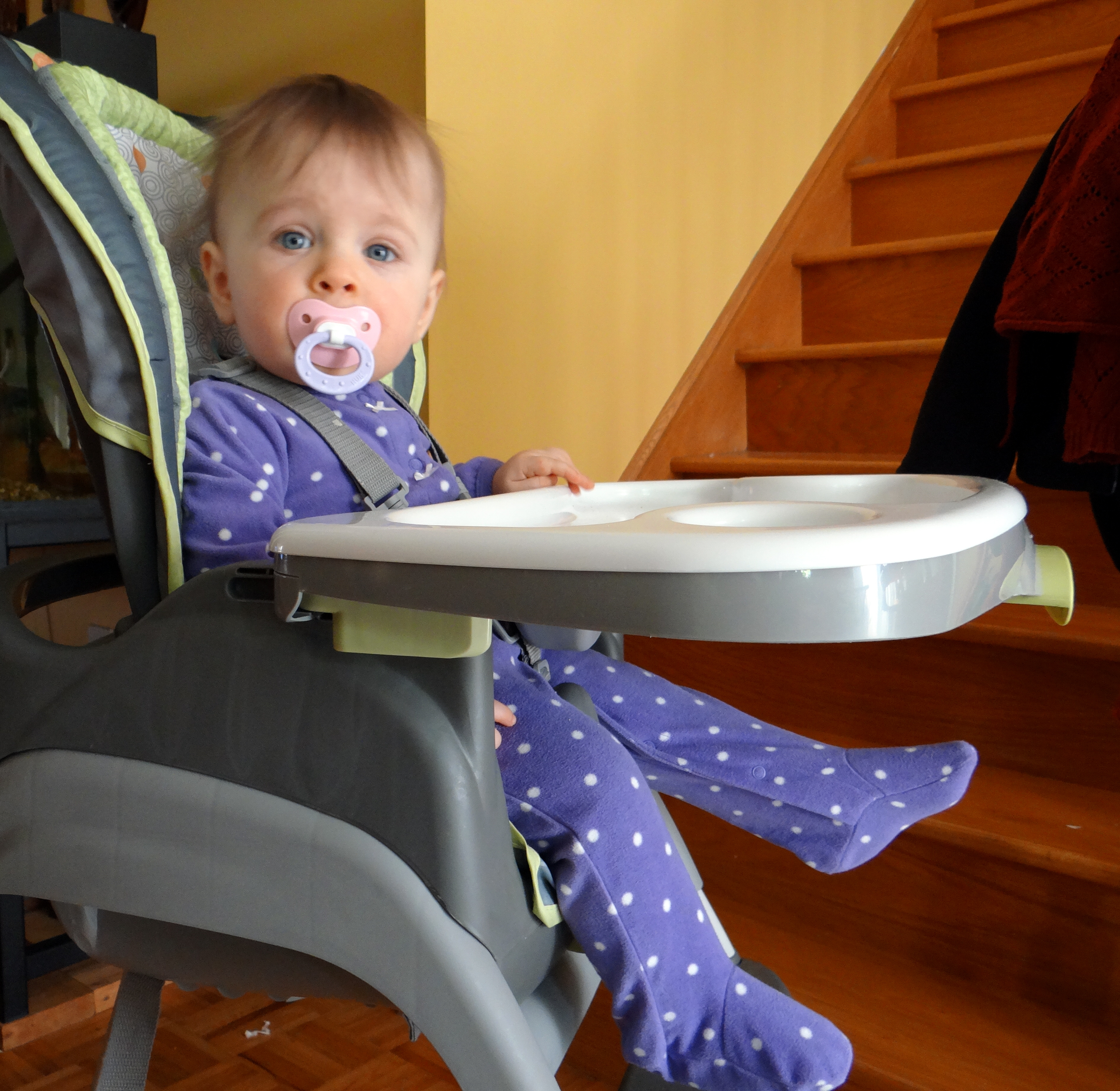 Baby girl in a high chair