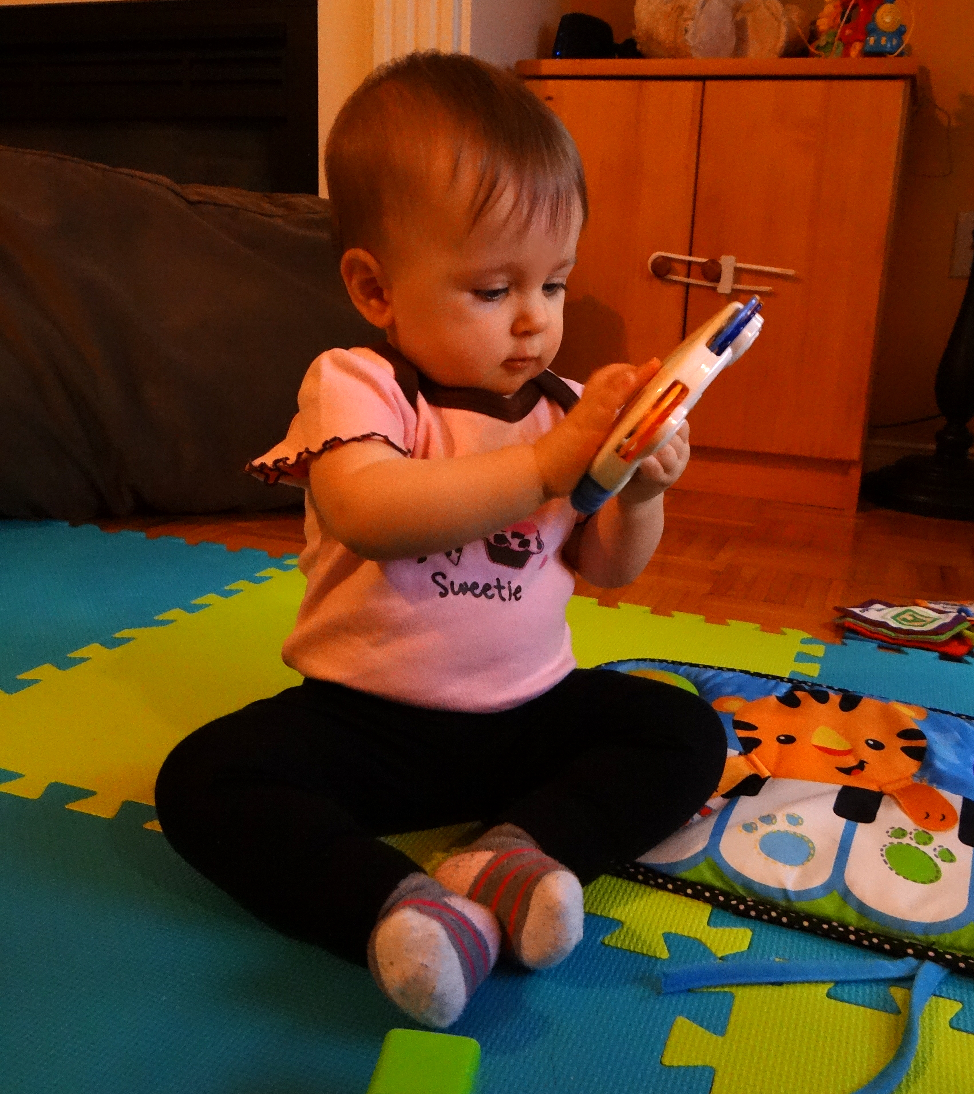 Baby playing with infant toys